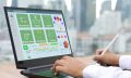An,Hr,Officer,Uses,Hr,Software,On,A,Laptop,To