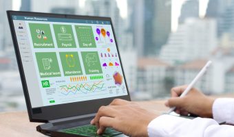 An,Hr,Officer,Uses,Hr,Software,On,A,Laptop,To
